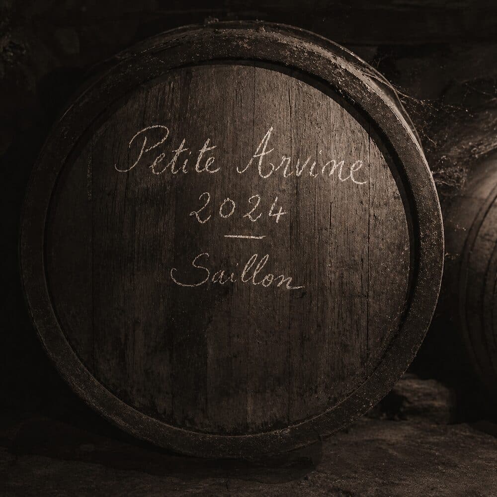 Oak wine barrel with chalk handwriting reading Petite Arvine 2024 Saillon